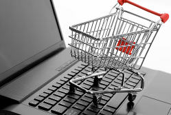 Shopping trolley on a computer keyboard