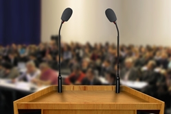 Speaking lectern representing giving a presentation]