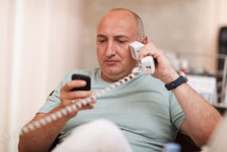 Man using two phones