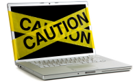 IT policy - laptop with caution tape{{}}