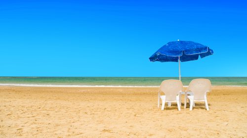 Chairs on beach — out of office